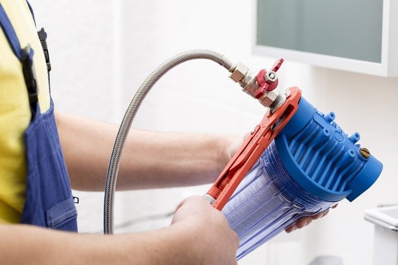 plumber installing new water filter_ronstik_shutterstock