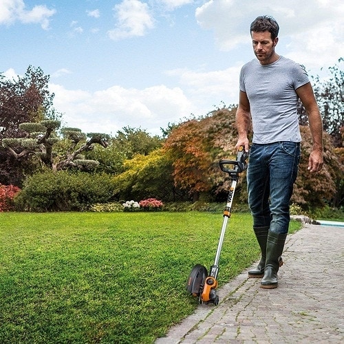 man trimming the grass
