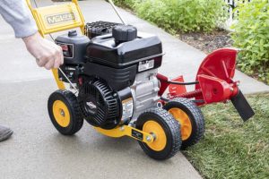 hand holding McLane Gas Powered Lawn Edger