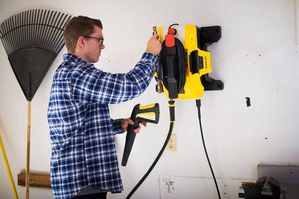 man setting up Stanley SLP2050 Electric Power Washer