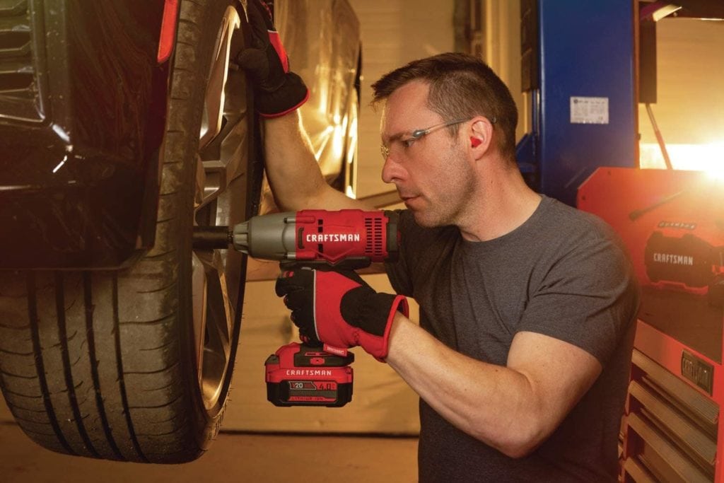 man using CRAFTSMAN CMCF900M1 Impact Wrench
