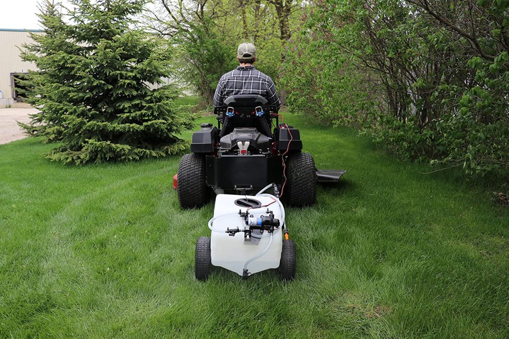 man using Homestead SL6-46-012Q-HS Pull & Tow Trailer Sprayer