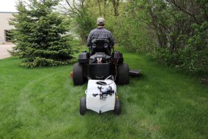 man using Homestead SL6-46-012Q-HS Pull & Tow Trailer Sprayer