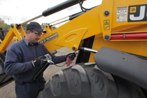 man using Lumax LX-1152 Pistol Grease Gun