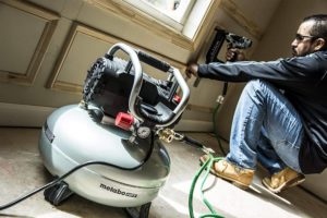man using Metabo KNT50AB HPT Air Compressor
