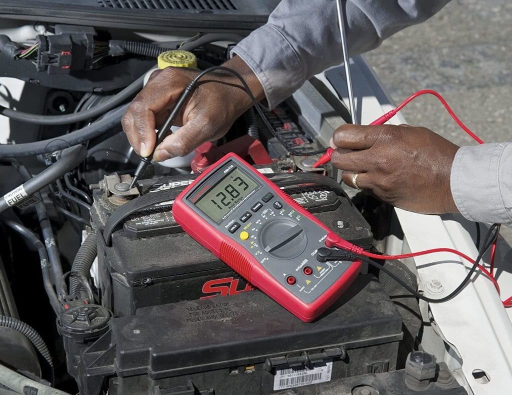 person using Amprobe AM-510 Multimeter