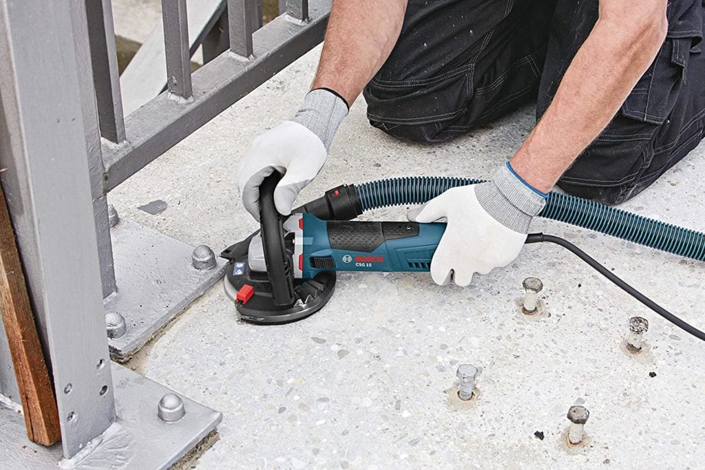 person using Bosch CSG15 Concrete Surfacing Grinder