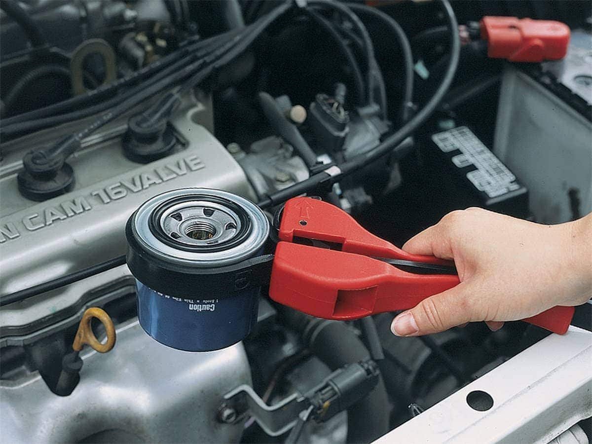 person using General Tools 1566 Rubber Strap Wrench