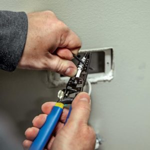 person using Klein Tools 11055 Wire Cutter