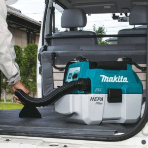 person using Makita XCV11Z Portable Wet:Dry Vacuum