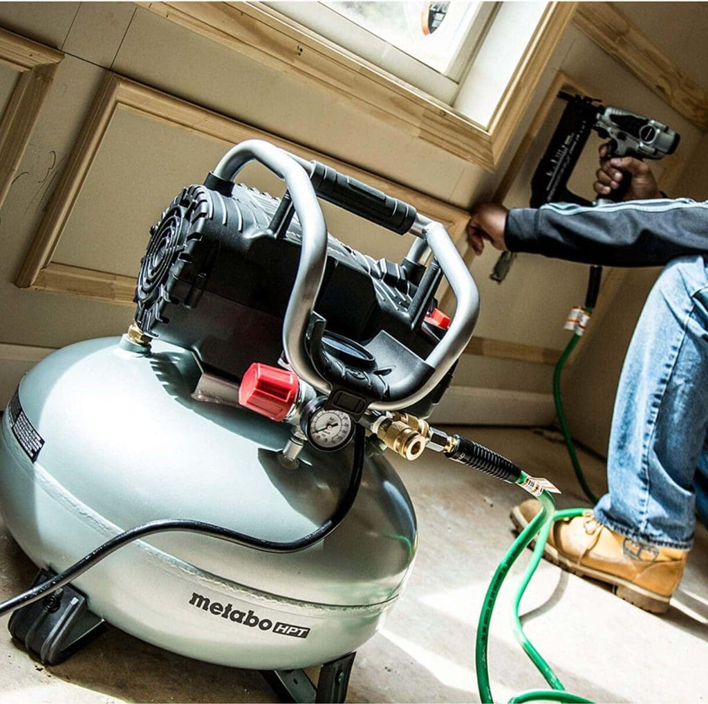 person using Metabo EC710S HPT Pancake Air Compressor