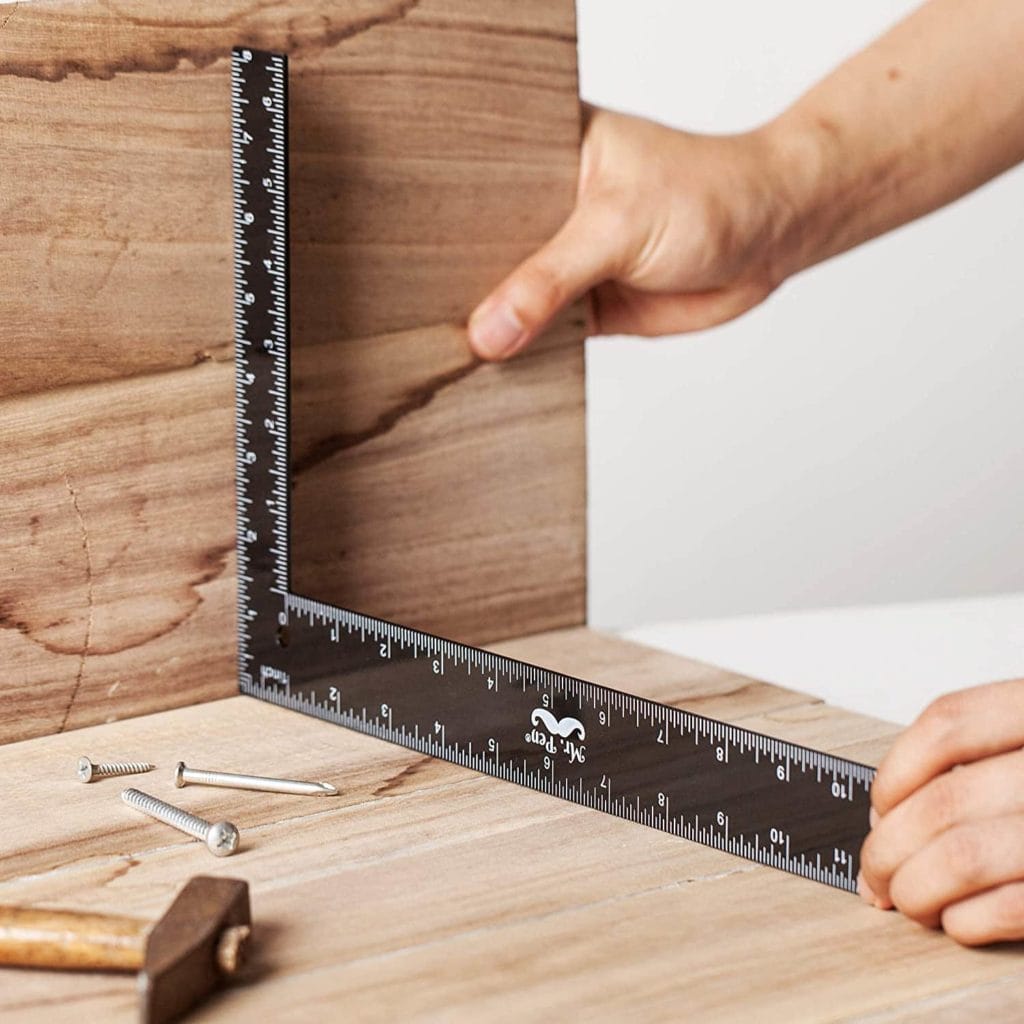 person using Mr. Pen- Carpenter Framing Square