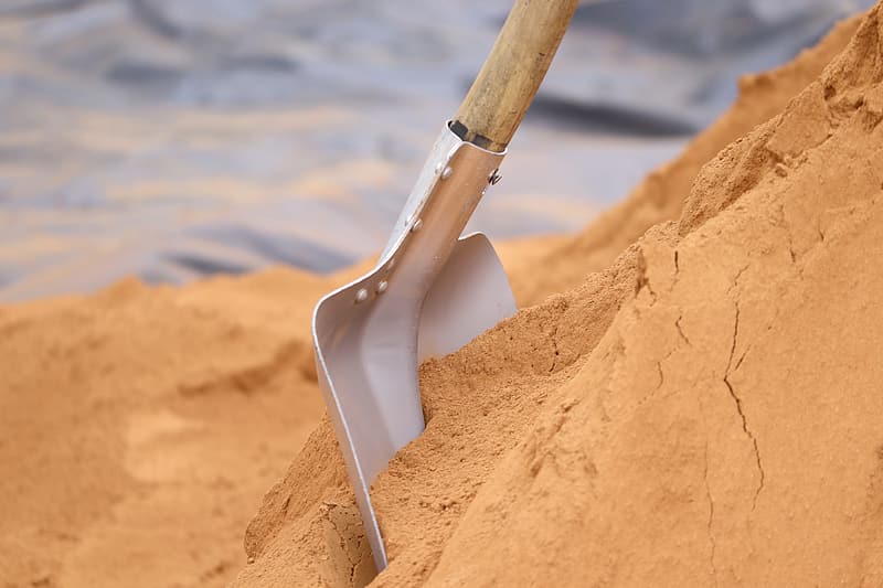 shovel on brown sand