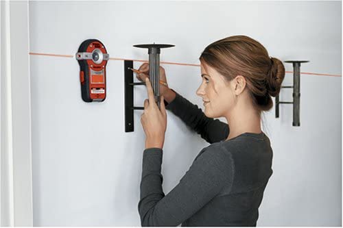 woman using BLACK+DECKER BDL190S BullsEye Stud Finder