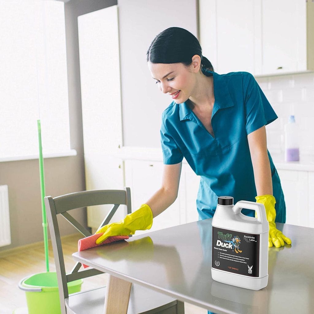 woman using Tuff Duck Grout Sealer