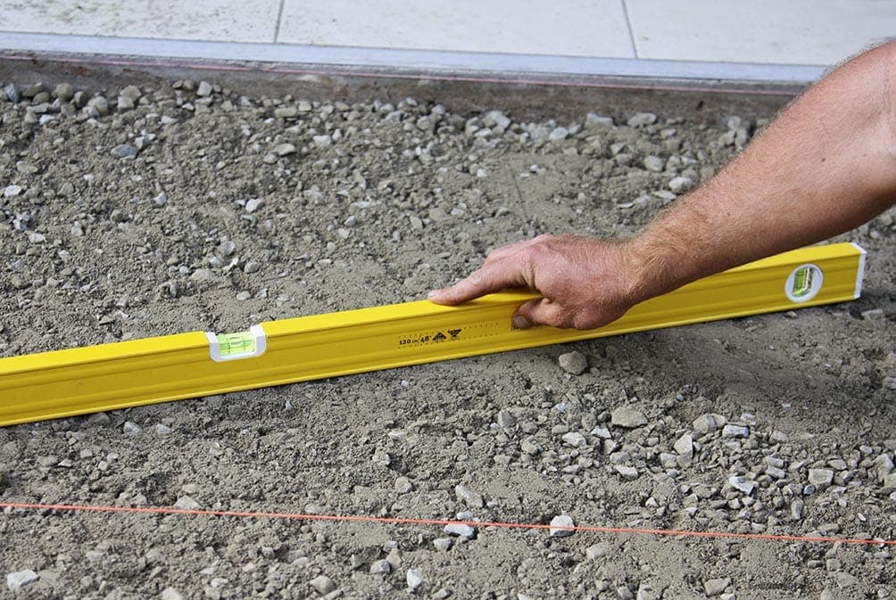 person leveling the ground