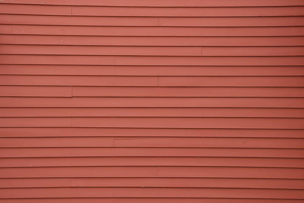 Cost To Install Vinyl Siding In 2024 Cost Per Square Foot House Grail   Red Vinyl Siding Cole Ciarlello Unsplash 