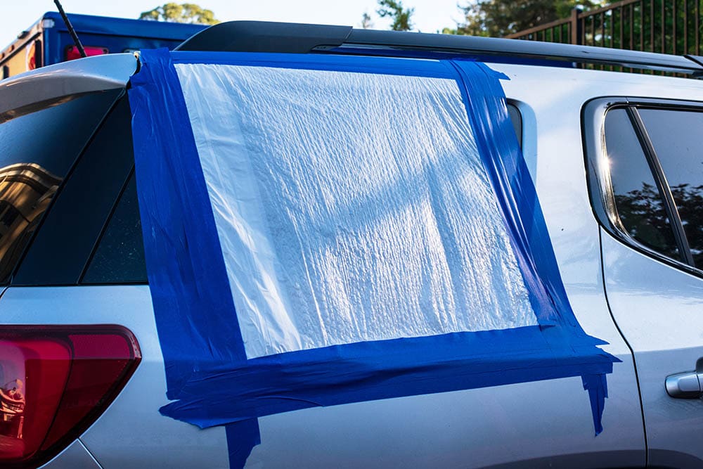 broken car window with cover