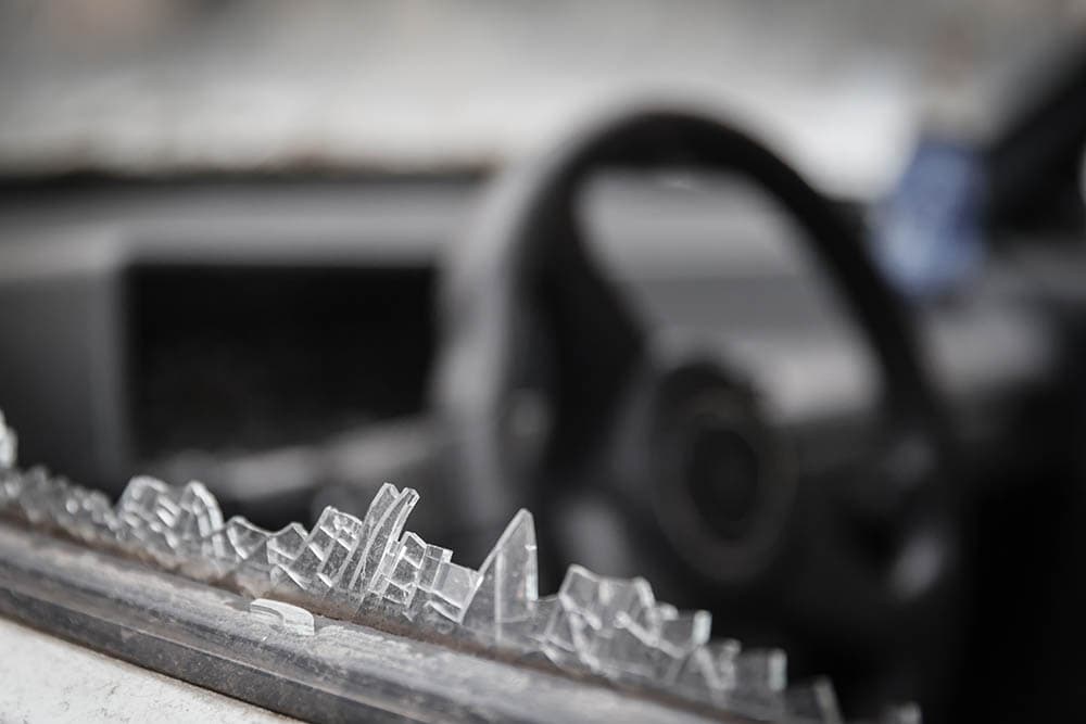 close up broken car window edge