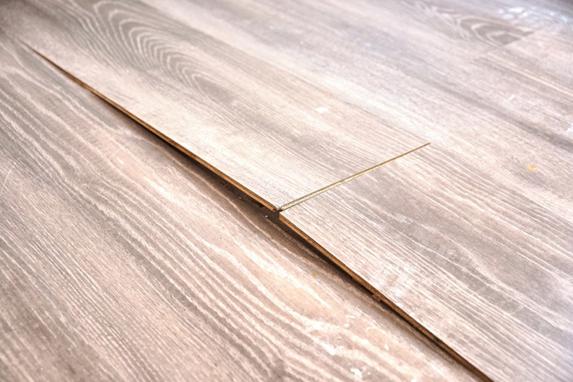 damaged and uneven hardwood floor