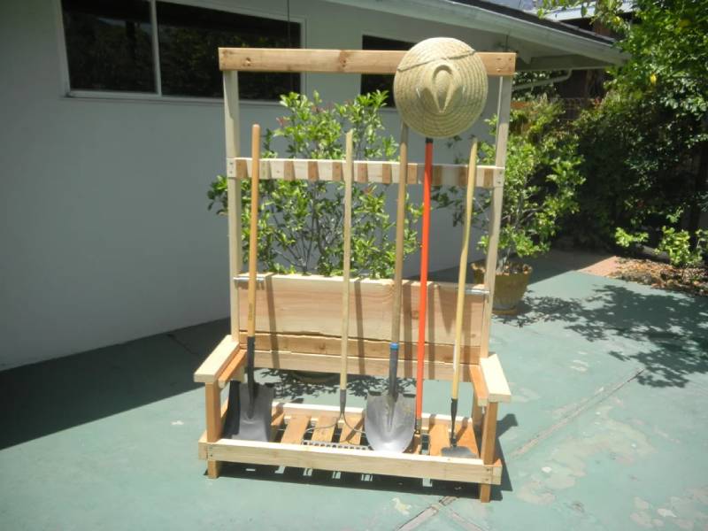 DIY garden tool rack with foldable bench