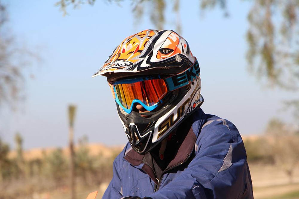 person wearing white printed helmet