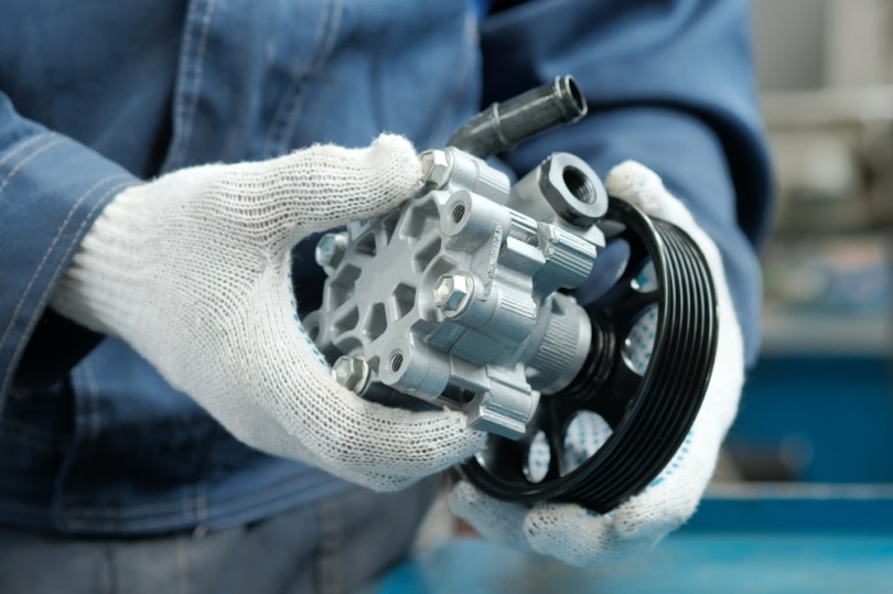 How Much Does It Cost To Replace A Power Steering Pump In 2024 House   Power Steering Pump Hold By Mechanic Palitsyn Evgenii Shutterstock 