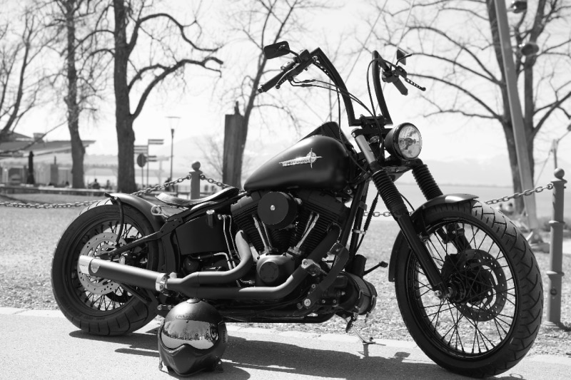 Black and white photo of motorcycle with Frisco handlebar