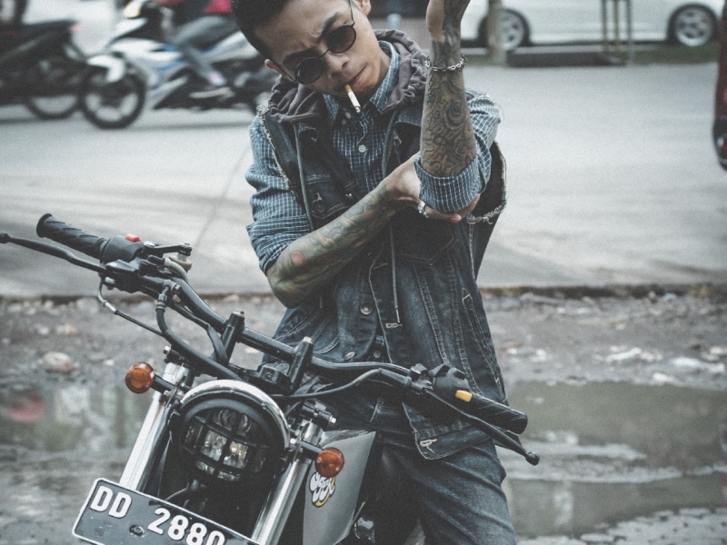 Man on a motorcycle with drag handlebars