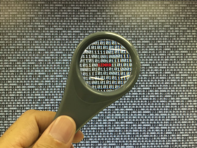 man holding magnifying glass