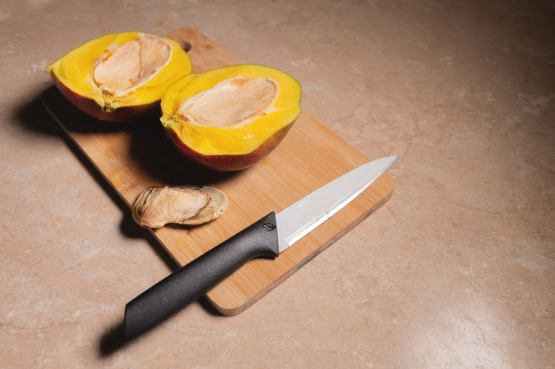 slice mango in woden board
