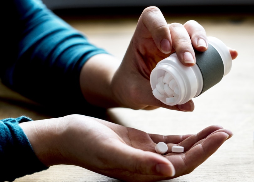 woman taking medicine