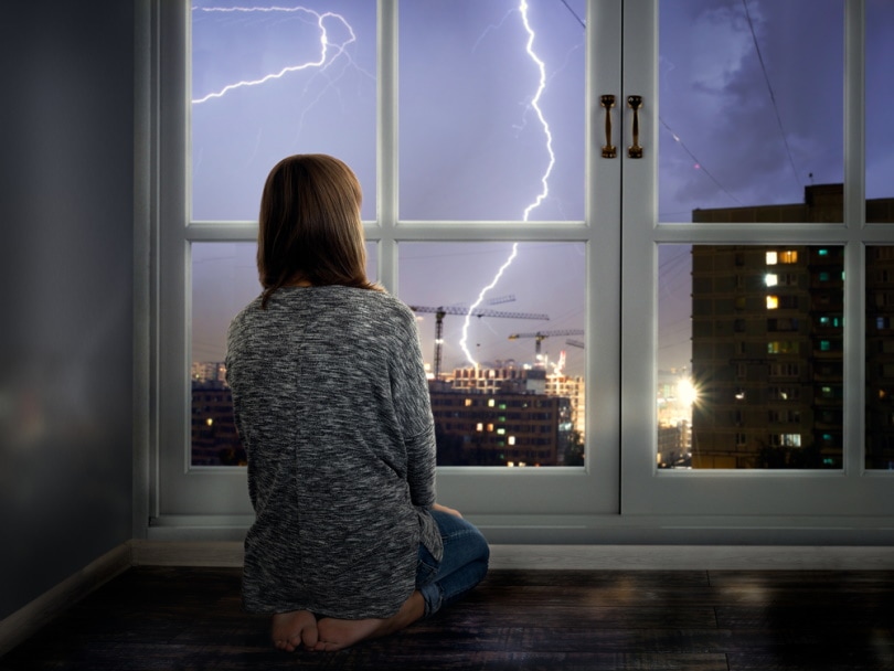 can lightning strike you through a house window