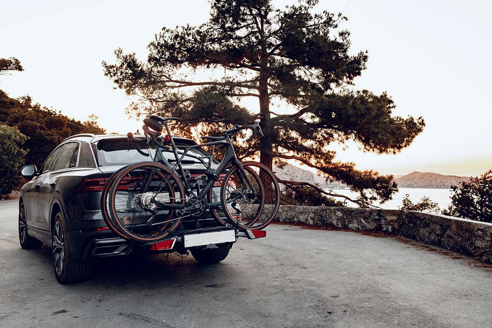 Crossover car with two road bicycles loaded on a rack