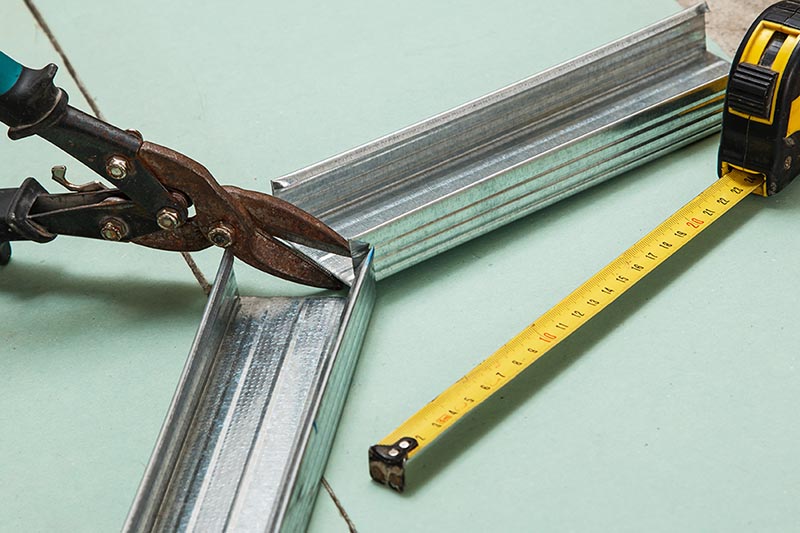 studs measuring tape and pliers