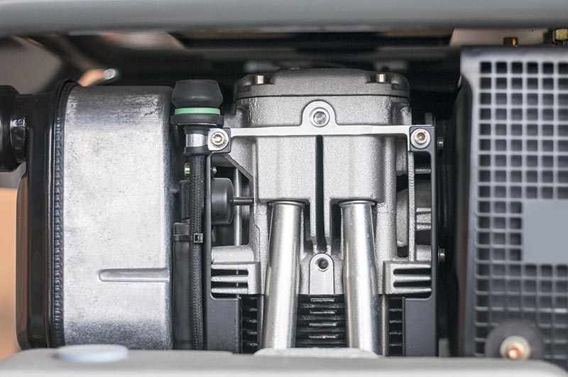 Two-stroke engine of a machine