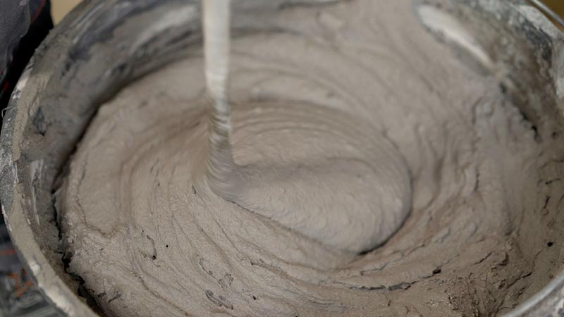 worker mixes the mortar