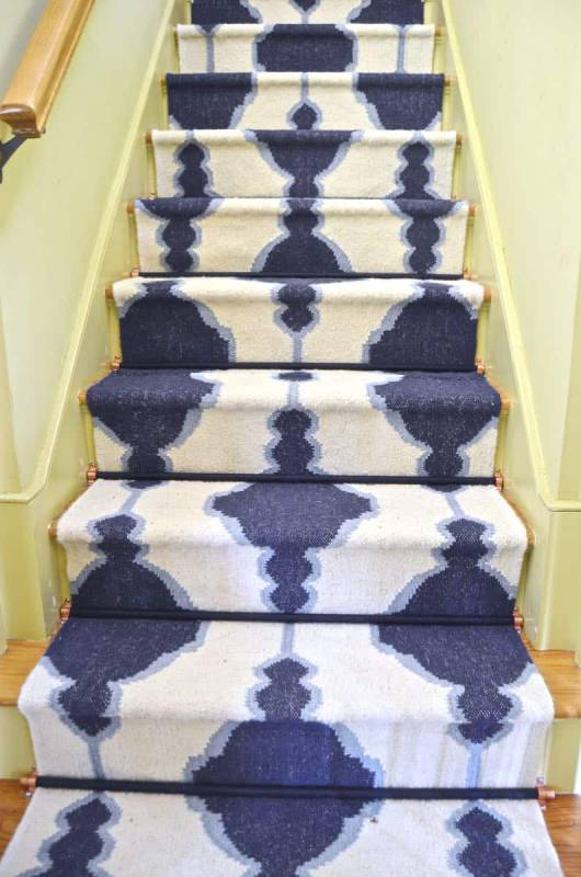 DIY staircase runner with stair rods
