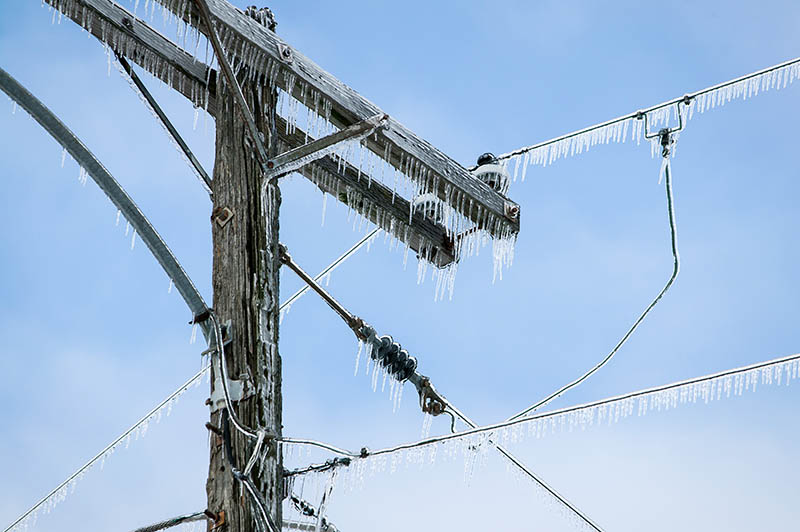 Glazed Power Line Utility Pole Electric Line from Winter Ice Snow Storm