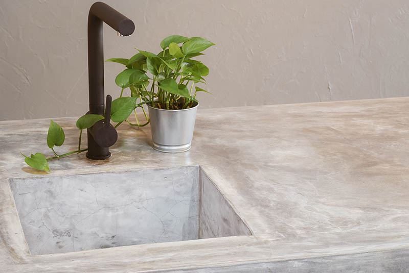 Morden black faucet and kitchen room sink with cement countertops
