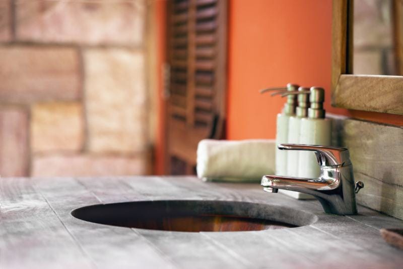 Natural Stone bathroom countertop and a Wooden sink