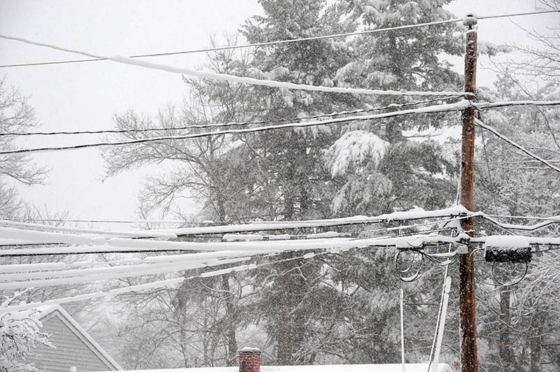 Snow accumulated on power line after snow storm