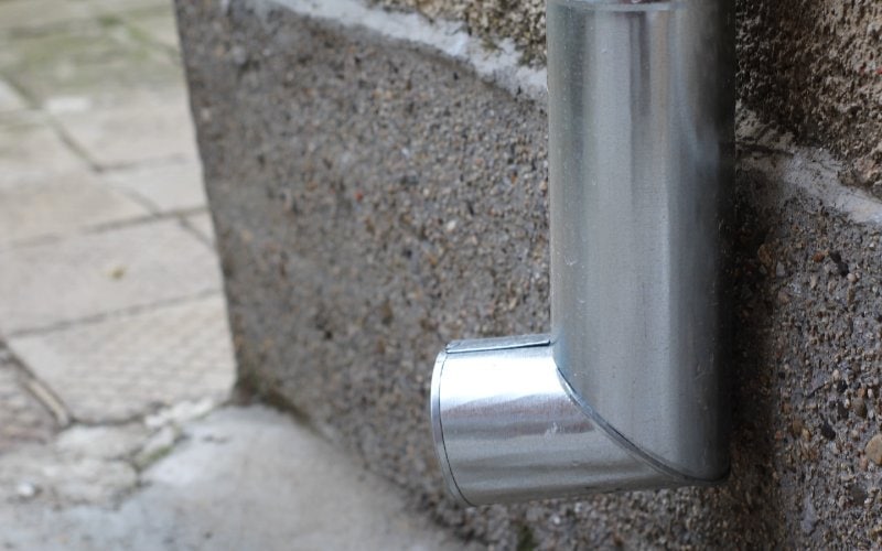 a stainless elbow gutter downspout