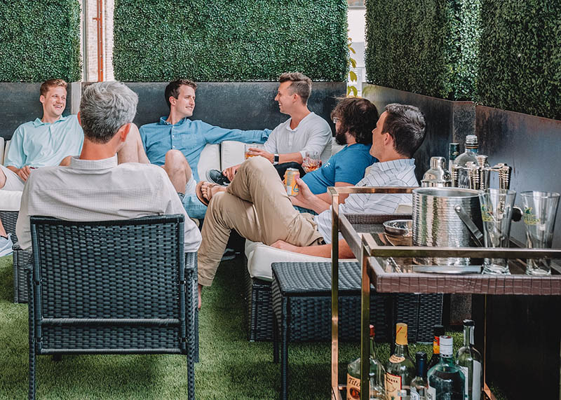 group of men having fun in an outdoor bar
