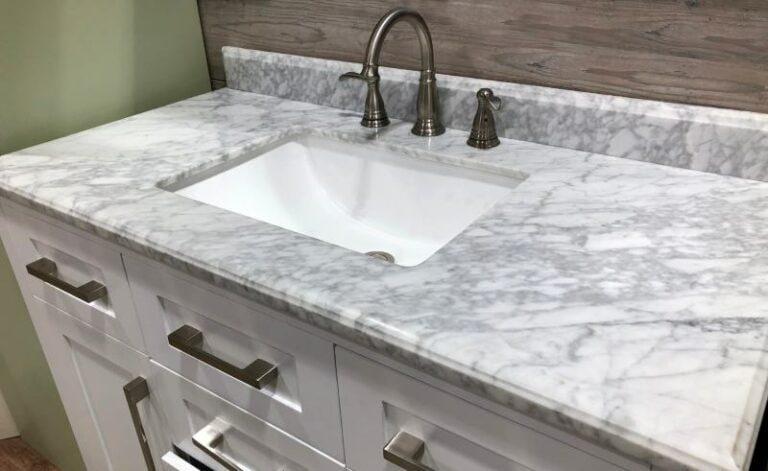 Marble Countertop With White Wooden Cabinets StudioDin Shutterstock 768x471 