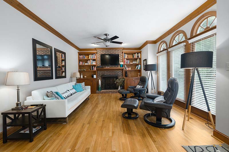 A Living Room With A White Sofa And Arched Windows Curtis Adams Pexels 