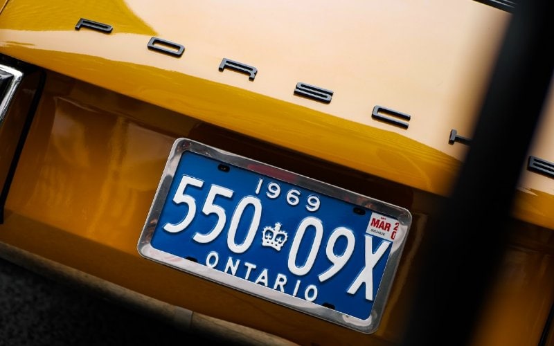 Ontario license plate on a yellow Porsche car