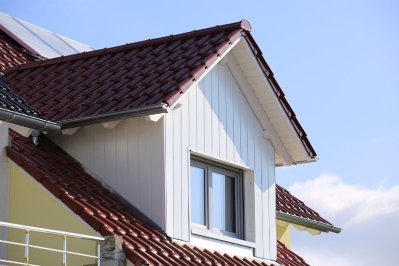 Tiled roof with wooden cladded window
