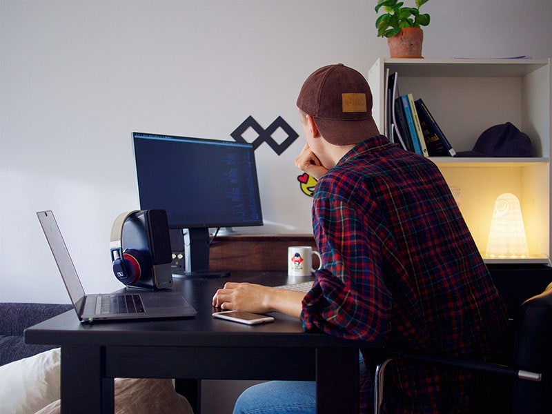 man working from home starting at his computer_Jumpstory