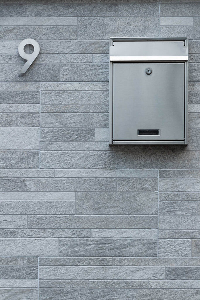 metal mailbox mounted on the wall